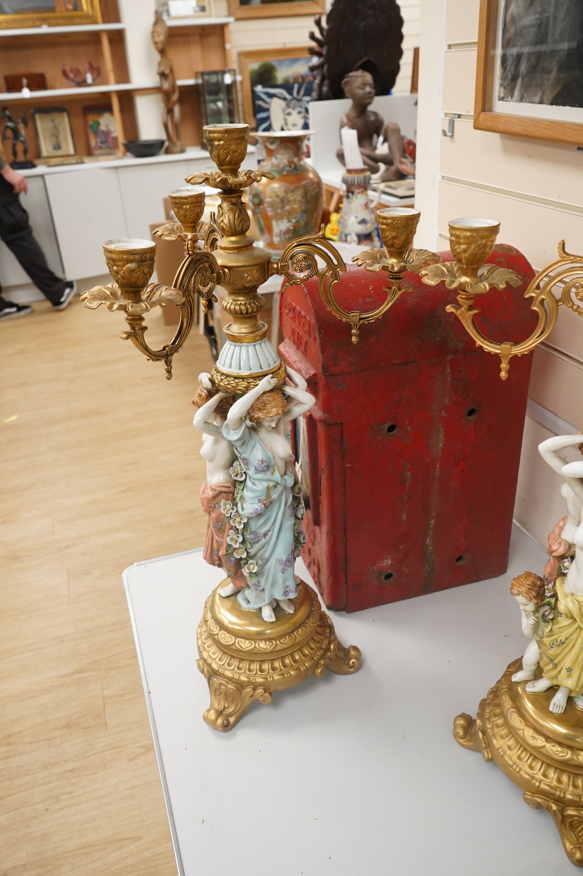 A pair of mid 20th century Italian porcelain and gilt metal mounted figural candelabra- 69cm high